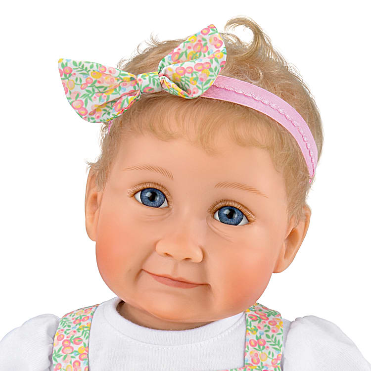 Poseable Lifelike Baby Doll Featuring A Custom Floral-Print Bubble 