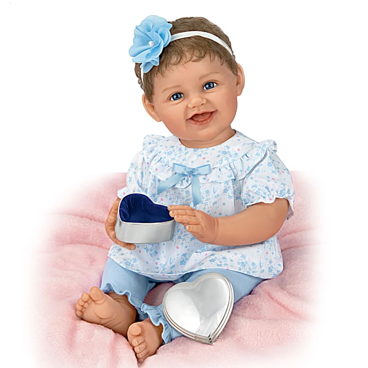 Poseable Lifelike Baby Doll With A Blue Floral Outfit And