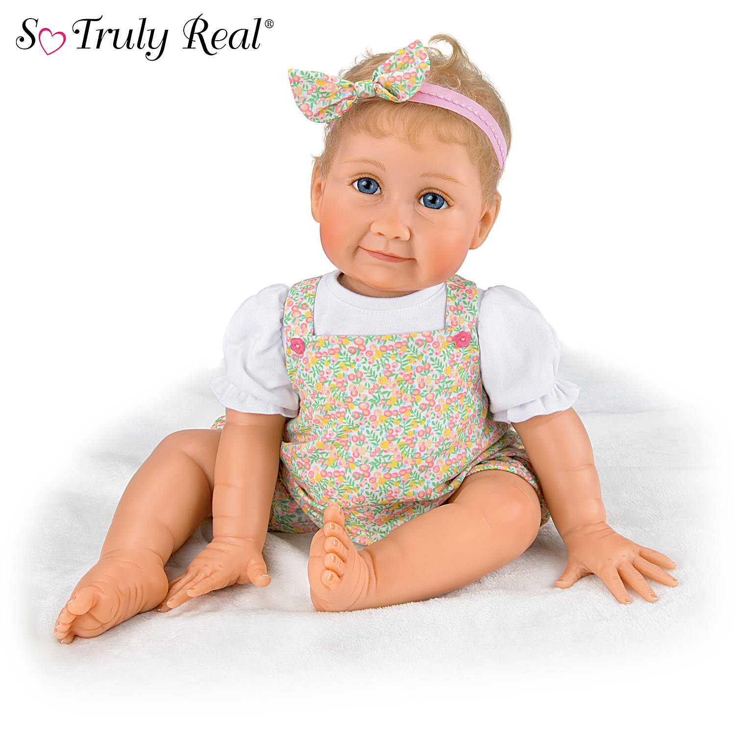 Poseable Lifelike Baby Doll Featuring A Custom Floral-Print Bubble 
