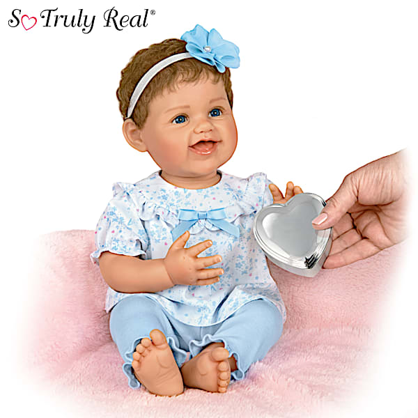 Poseable Lifelike Baby Doll With A Blue Floral Outfit And Heart Shaped Keepsake Box